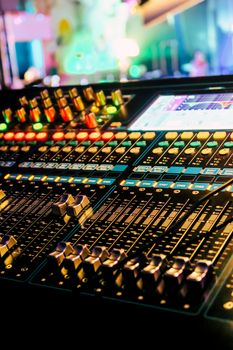 Closeup of an audio mixing control panel