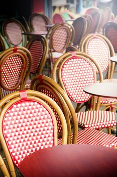 many Vintage chairs outside a pub