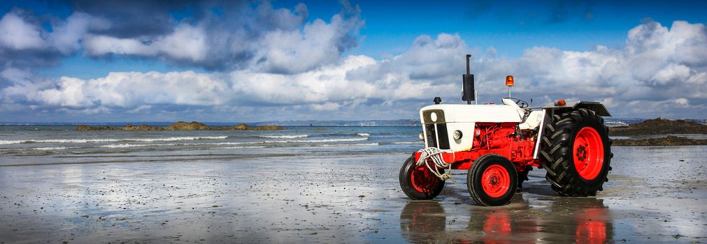 a Stationary tractor on the shoreline