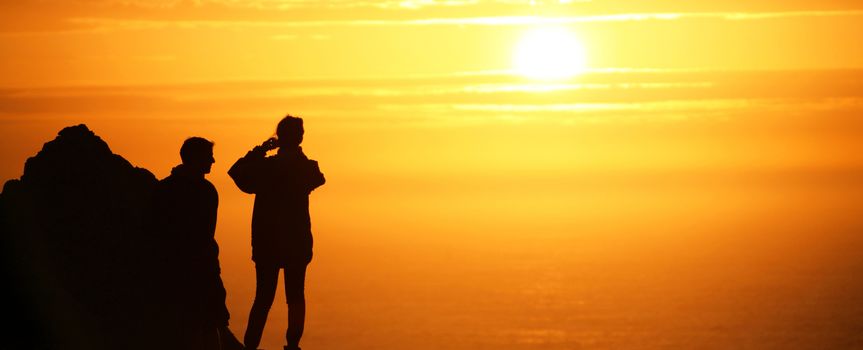 a Couple strolling at sunset