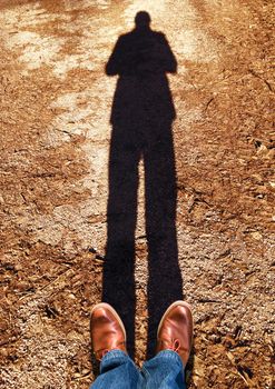 standing on the asphalt with a shadow