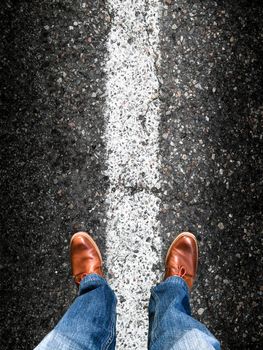 standing on an asphalt floor