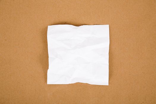 White sheet on cardboard background