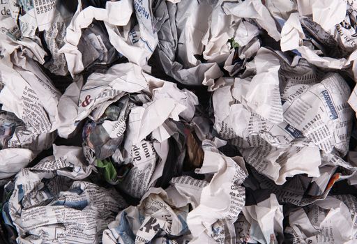 Newspapers folded and crushed to form a background