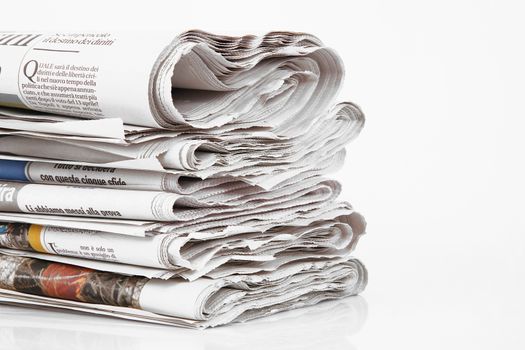Newspapers folded on white background