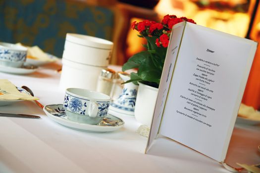 a menu resting on the table at the restaurant