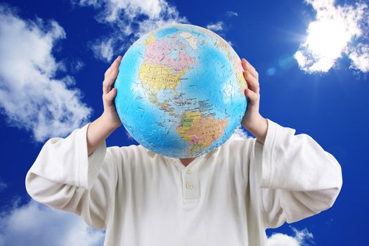Little boy holding with hands a globe in place of head