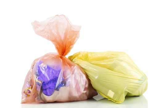 bags full of garbage on white background