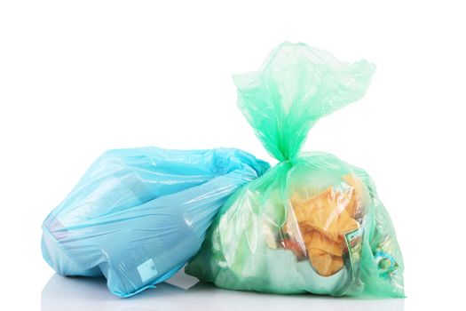 bags full of garbage on white background