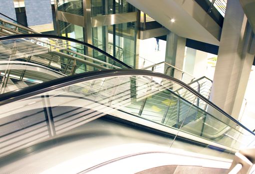 an escalator inside a shopping centre
