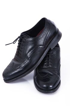elegant male shoes on white background