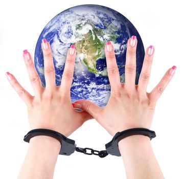 the planet Earth with hands and handcuffs