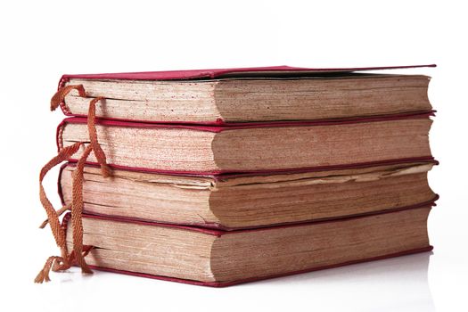 Stack of books on white background