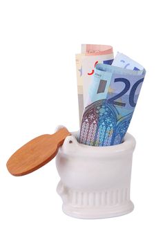 Money in toilet on white background
