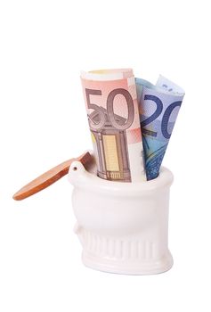 Money in toilet on white background