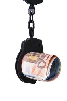 Money under handcuffs on white background