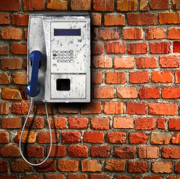 old public phone on wall background
