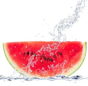 fresh watermelon falling in water