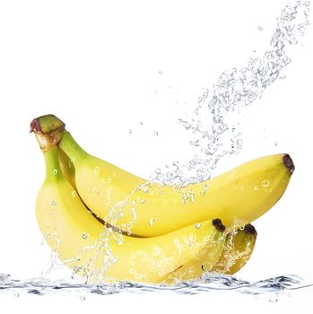 fresh bananas falling in water