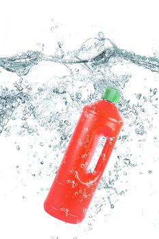 red plastic bottle falling in water