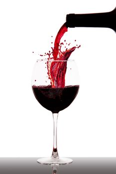 a glass with ice and wine splash