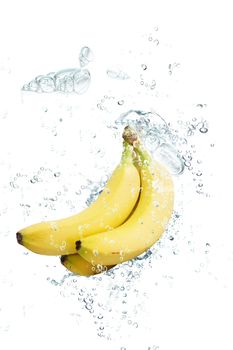 fresh bananas falling in water