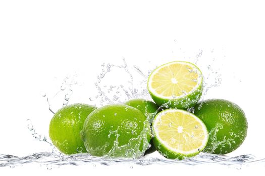 fresh lime falling in water