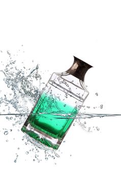 green glass bottle falling in water