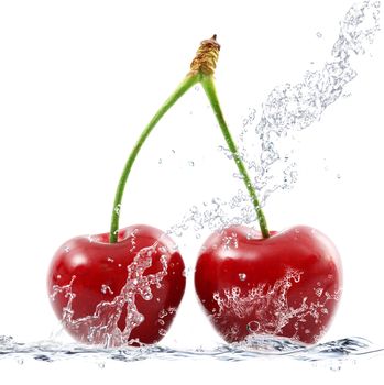 fresh cherries falling in water