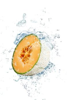 fresh melon falling in water