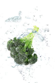 Fresh cabbage falling in pure water