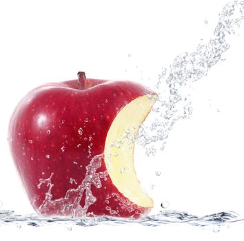 fresh apple falling in water