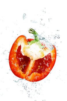fresh peppers falling in pure water