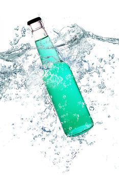 green glass bottle falling in water