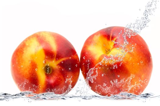 fresh peach falling in water