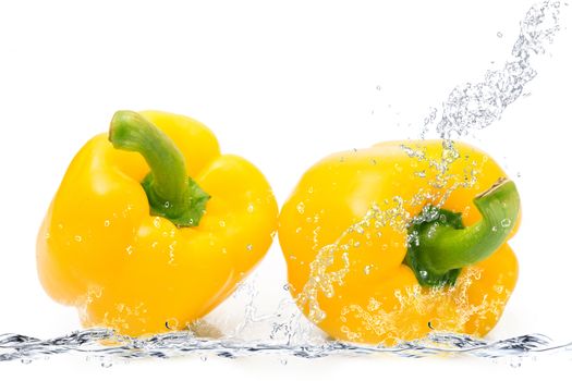 fresh peppers falling in pure water