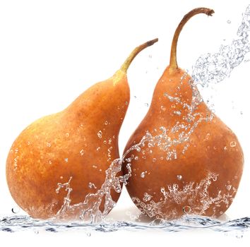 fresh pear falling in water