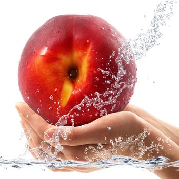fresh peach falling in water