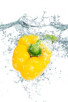 fresh peppers falling in pure water