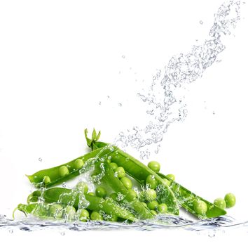 fresh peas falling in pure water