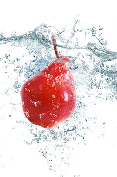 fresh pear falling in water