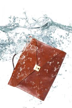 little suitcase falling in water