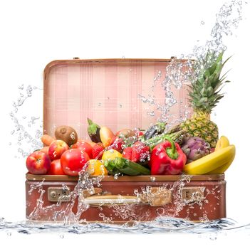 fresh fruit in suitcase falling in water