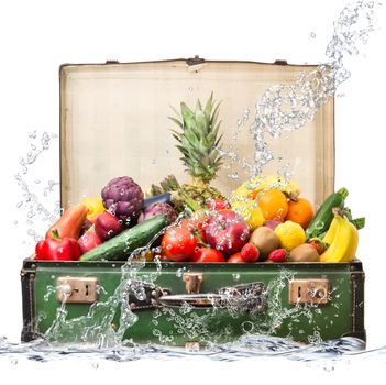 fresh fruit in suitcase falling in water