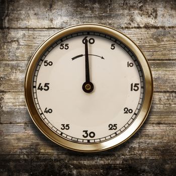 a vintage watch on a wooden background