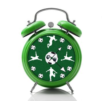 isolated alarm clock with soccer dial on white background