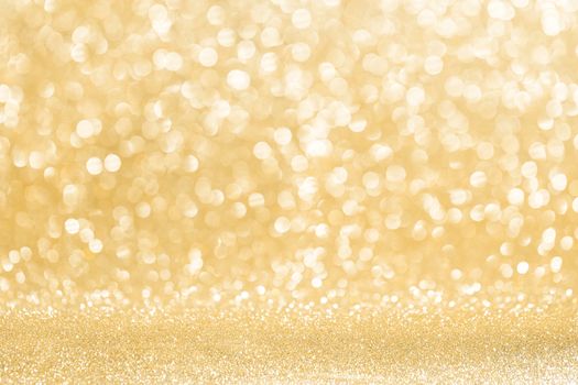 Abstract shining glitters gold holiday bokeh background with copy space for text