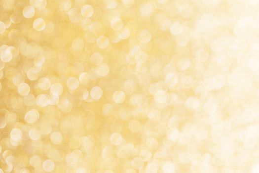 Abstract shining glitters gold holiday bokeh background with copy space for text