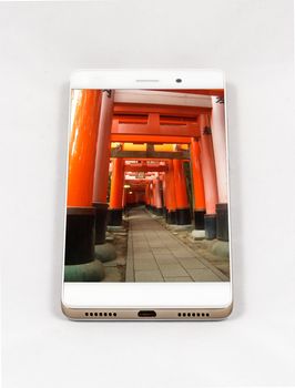 Modern smartphone with full screen picture of Kyoto, Japan. Concept for travel smartphone photography. All images in this composition are made by me and separately available on my portfolio