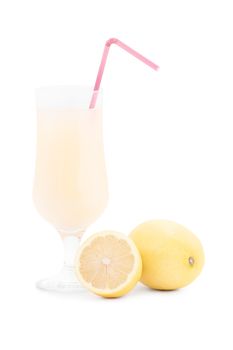 Glass of fresh lemonade with straw and freshly cut lemon fruits, isolated on white background.